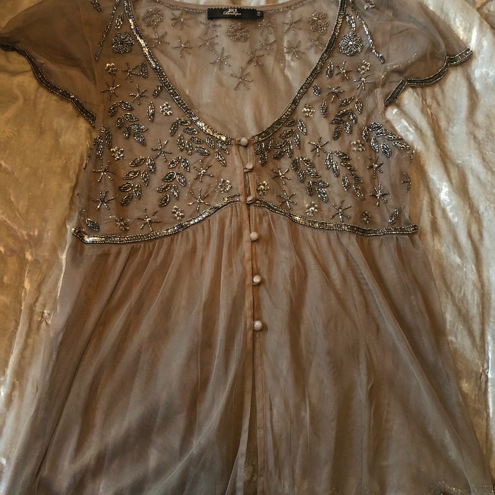 Buckle boutique sheer top